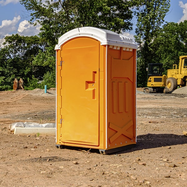 what is the cost difference between standard and deluxe portable toilet rentals in Erin